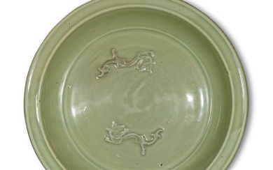 A large molded 'Longquan' celadon-glazed 'chilong' dish, Yuan / Ming dynasty | 元 / 明 龍泉窰青釉螭龍紋大盤