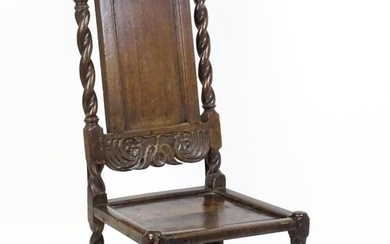 A late 17thC oak back stool with a carved cresting rail and turned uprights alongside a panel back