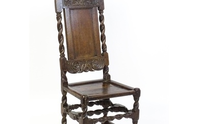 A late 17thC oak back stool with a carved cresting rail and ...