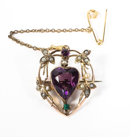 A late 19th century 9ct gold brooch with a central heart shaped amethyst surrounded by seed pearl