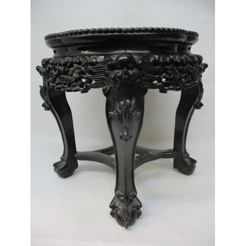 A late 19th century Chinese hardwood stand with a lobed inse...