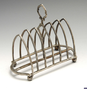 A late Victorian silver toast rack & a 1930's silver dish. (2).