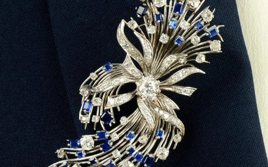 A mid 20th century 18ct gold sapphire and vari-cut diamond floral spray brooch.Principal diamond