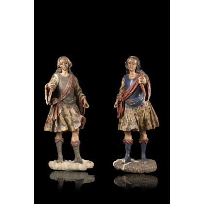A pair of 18th-century Florentine lacquered and gilded wooden candle-holders representing male figures (h cm 132) (losses and restorations)