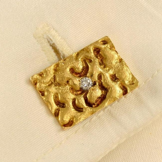 A pair of 1970s 18ct gold textured cufflinks, with brilliant-cut diamond highlight. Estimated total