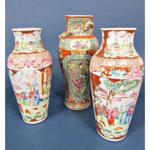 A pair of 19th century Famille Rose vases of shouldered form...