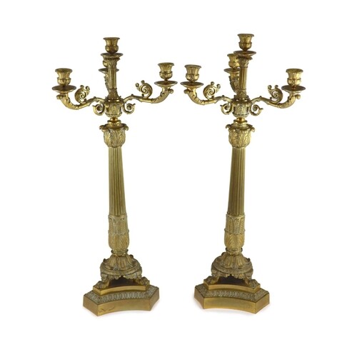 A pair of 19th century French Empire style ormolu candelabra...