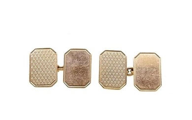 A pair of 9ct gold cufflinks, rectangular panels with truncated corners, one with an engine turned