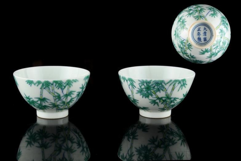 A pair of Chinese doucai wine cups, each painted...