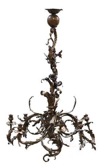 A pair of French rococo-style gilt bronze eight-light chandeliers