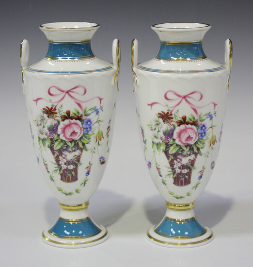 A pair of Minton Bicentenary Rose Basket two-handled vases of shield shape, decorated with flower ba