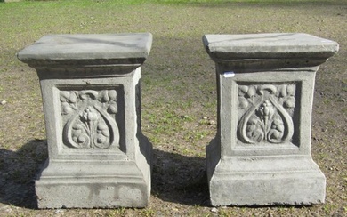 A pair of cast composition stone square cut and stepped pede...