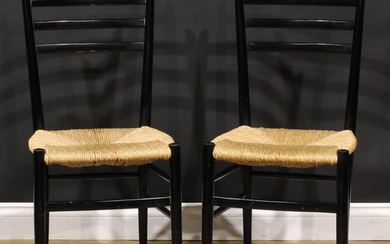 A pair of mid-20th century Italian ebonised beech side chair...
