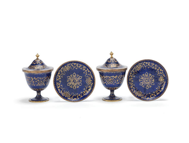 A pair of rare gilt-decorated blue enamel covered stem cups and stands