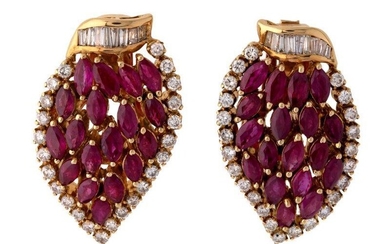 A pair of ruby and diamond ear clips, each of leaf design claw set with navette-cut rubies within a border of brilliant-cut and baguette diamonds, clip and post fittings, 3cm x 2cm