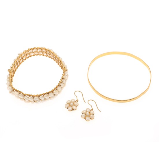 A pearl jewellery collection comprising two bangles and a pair of ear pendants partly set with cultured fresh water pearls, mounted in 21.5k gold. (4)