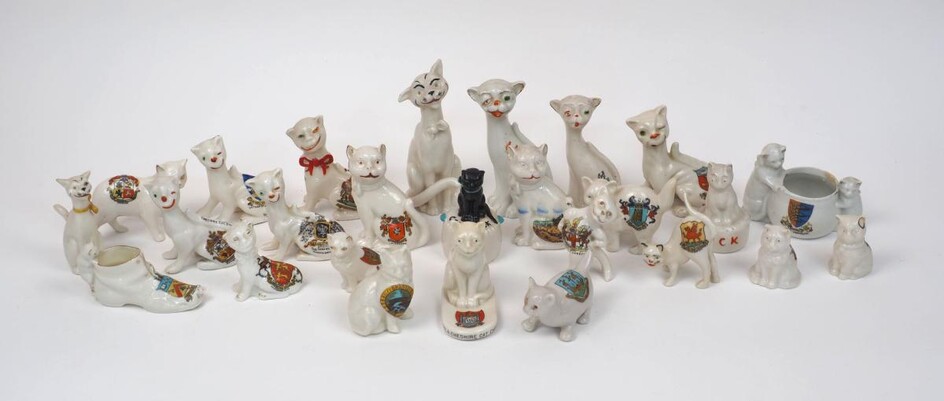 A quantity of porcelain Cheshire cats bearing various county crests, from a variety of makers to include Crafton china, Arcadia china, Willow Longton china, Stoke-on-Trent porcelain, Victoria china, W.H. Goss, and other unmarked examples, tallest...