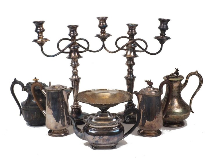 A quantity of silver plate including: a twin-handled tray; a pair of miniature cylindrical bottle coasters; several coffee pots; a pair of candelabra (one with damaged branch); a sauce boat; a tankard and entrée dishes, together with a leather...