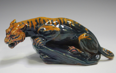 A rare Royal Doulton Sung Flambé tiger, early 20th century, designed by Charles Noke, modelled crou
