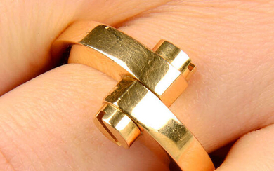 A screw-head motif 'Menotte' ring, by Cartier.