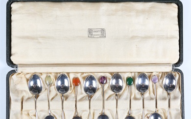 A set of eleven Arts and Crafts silver coffee spoons with hardstone terminals, Birmingham 1924 and 1