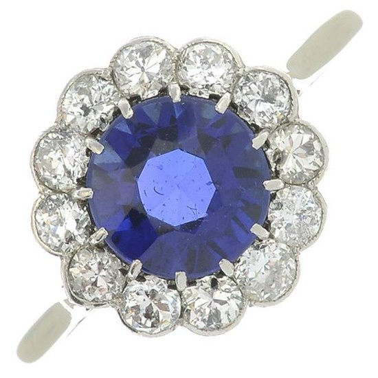 A synthetic sapphire and diamond cluster ring.Estimated