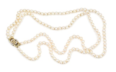 A twin strand uniform cultured pearl necklace, the 18ct yellow...