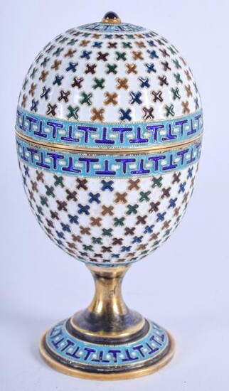 AN ANTIQUE RUSSIAN SILVER AND ENAMEL EGG CUP AND COVER