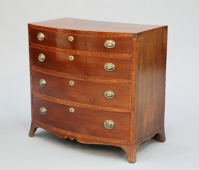 AN EARLY 19TH CENTURY MAHOGANY BOW-FRONT CHEST OF