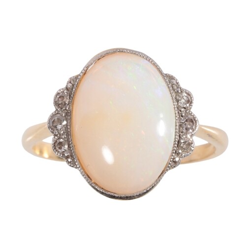AN OPAL AND DIAMOND RING the oval white tone opal, flanked e...