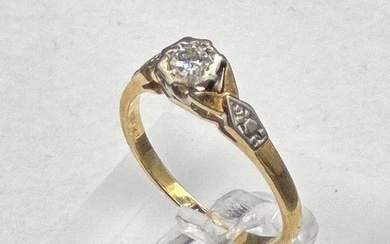 An 18ct and platinum set diamond ring with central stone and...