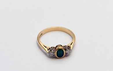 An 18ct gold three stone emerald and diamond ring