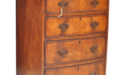 An 18th Century George III mahogany and walnut crossbanded bachelors chest of drawers. The bank of four straight drawers having a chamfered edge top with brass swing handles on circular backplates flanking armorial lock escutcheons. All raised on...