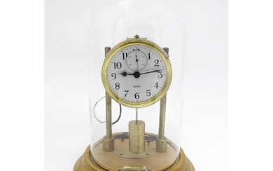 An American electric mantel clock by Barr , the dial with su...