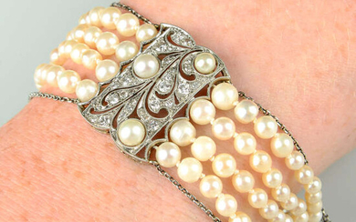 An Art Deco platinum and gold, graduated pearl multi-strand bracelet, with vari-cut diamond and pearl pierced spacers and clasp.