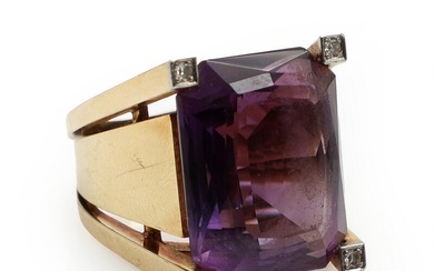 An amethyst and diamond ring set with a faceted amethyst and four...