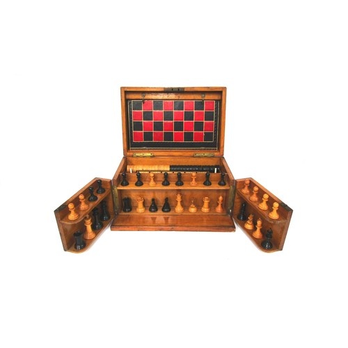 An early 20th Century oak cased games compendium with boxwoo...