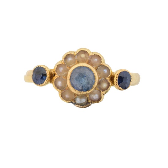 An early 20th century 18ct gold sapphire and split pearl cluster ring