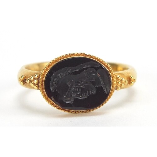 Antique unmarked gold intaglio seal ring carved with a gladi...