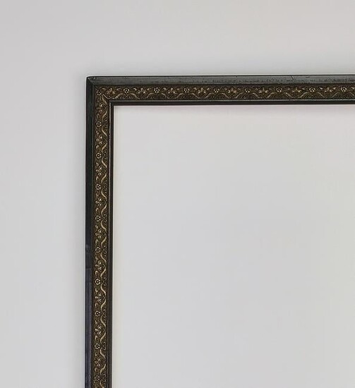 Baroque style ebonized and gilt-decorated frame