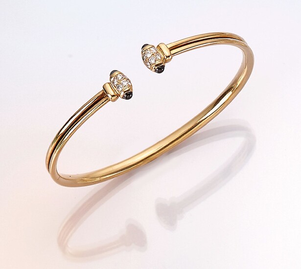 CARTIER 18 kt gold bangle with diamonds...