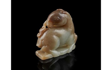 CELADON AND RUSSET JADE CARVING OF RAM 19TH-20TH CENTURY