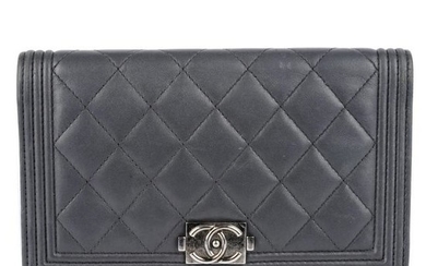 CHANEL - a Boy Flap wallet. Crafted from grey quilted