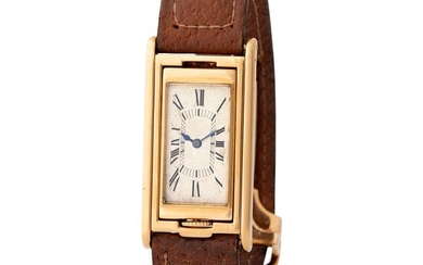 Cartier France. Extremely fine and elegant Tank basculante Rectangular-shape Wristwatch in Yellow Gold With Silver Roman Numbers Dial and Cabriolet System