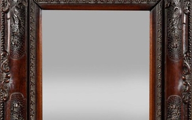 Carved exotic wood mirror decorated with foliage on a dotted background, palmettes and flowers. (a frame originally, glass brought back at a later date). Probably Portuguese Indies, 18th century. H : 47 cm, W : 42 cm