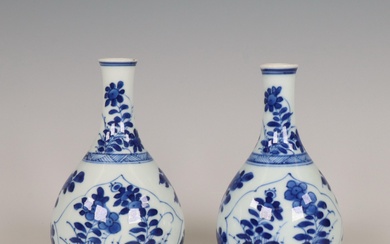 China, a pair of small blue and white porcelain bottle vases, Kangxi period (1662-1722)