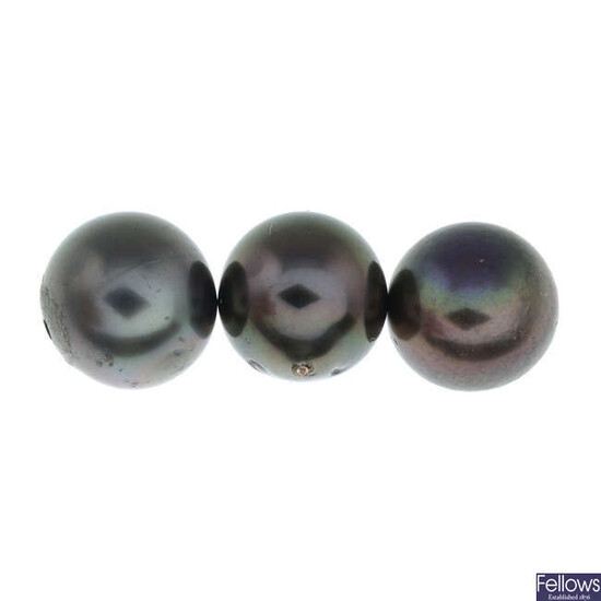 Eleven black cultured pearls, total weight 9.0gms.