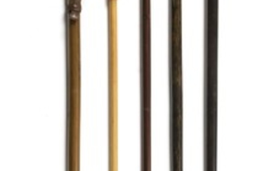 FIVE CANES Mostly wood. One with horn ferrule. One with leather wrist cord and metal ferrule. Lengths from 34" to 35.5".