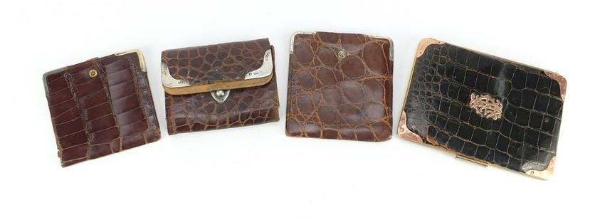Four crocodile skin effect leather wallets and purses