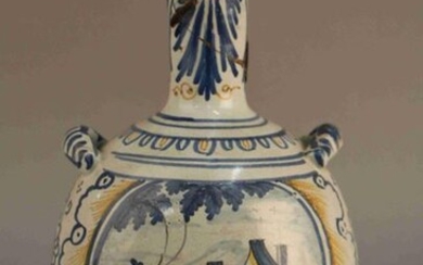 GOURDE with polychrome faience passageways decorated with two medallions with a character and a landscape. Nevers, 18th century. (missing and repairs) Height : 31 cm